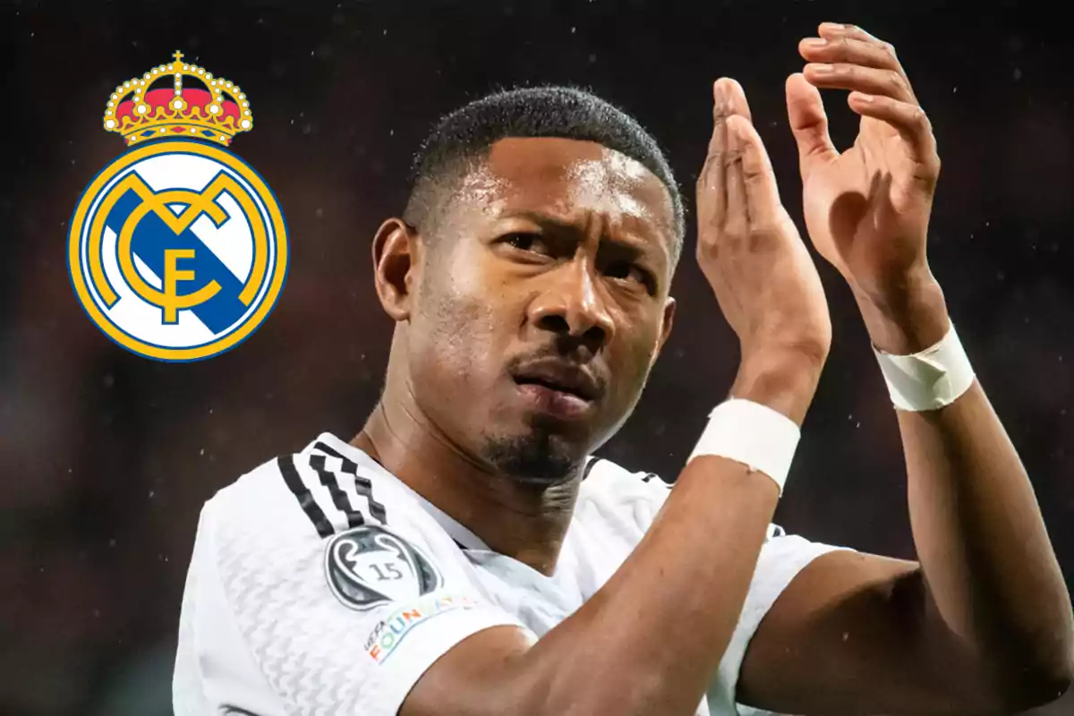 A player clapping with the Real Madrid logo in the background.