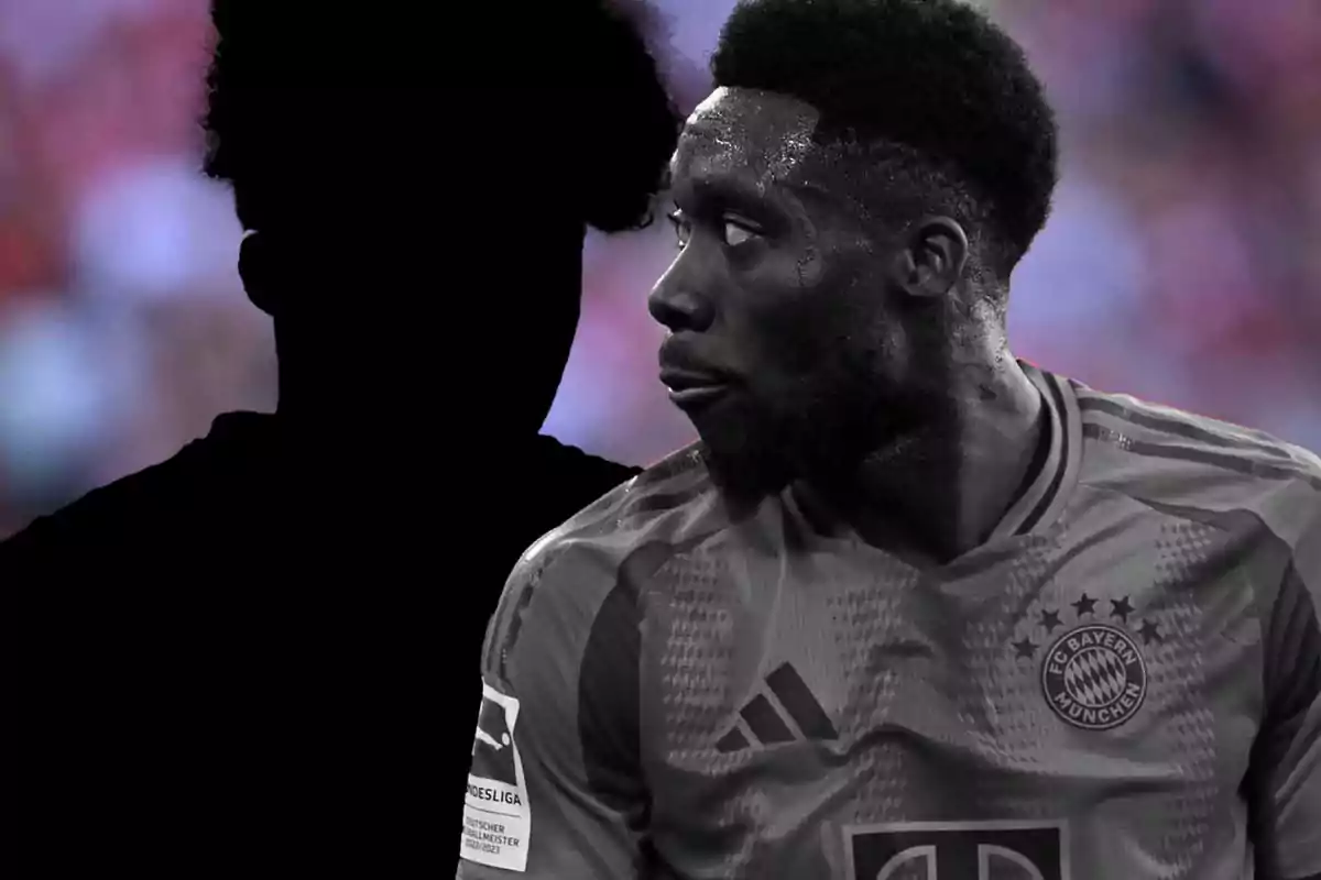 A Bayern Munich soccer player looks to the side as a dark silhouette stands next to him.