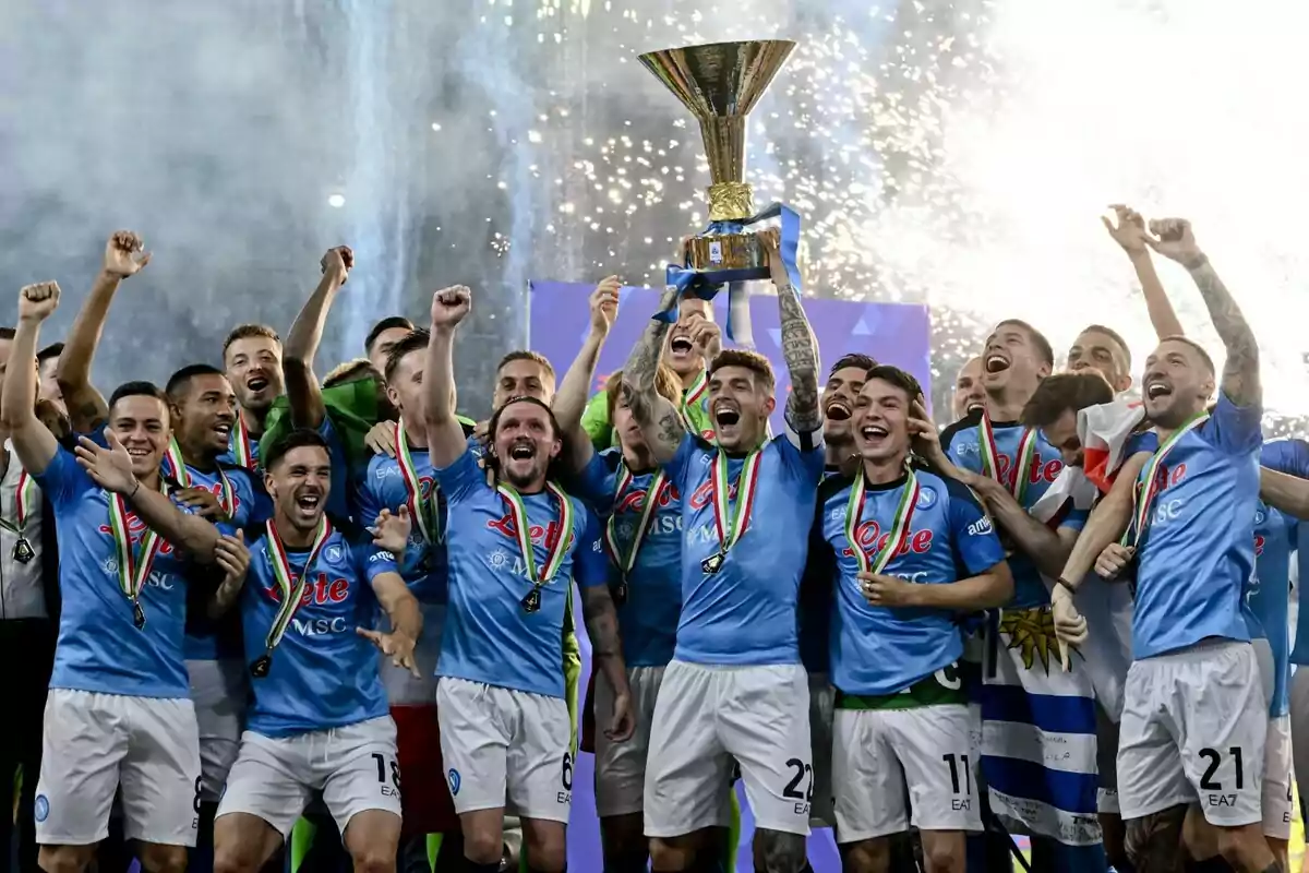 Napoli players celebrate ecstatically, lifting a championship trophy with fireworks in the background. Napoli players celebrate ecstatically, lifting a championship trophy with fireworks in the background.