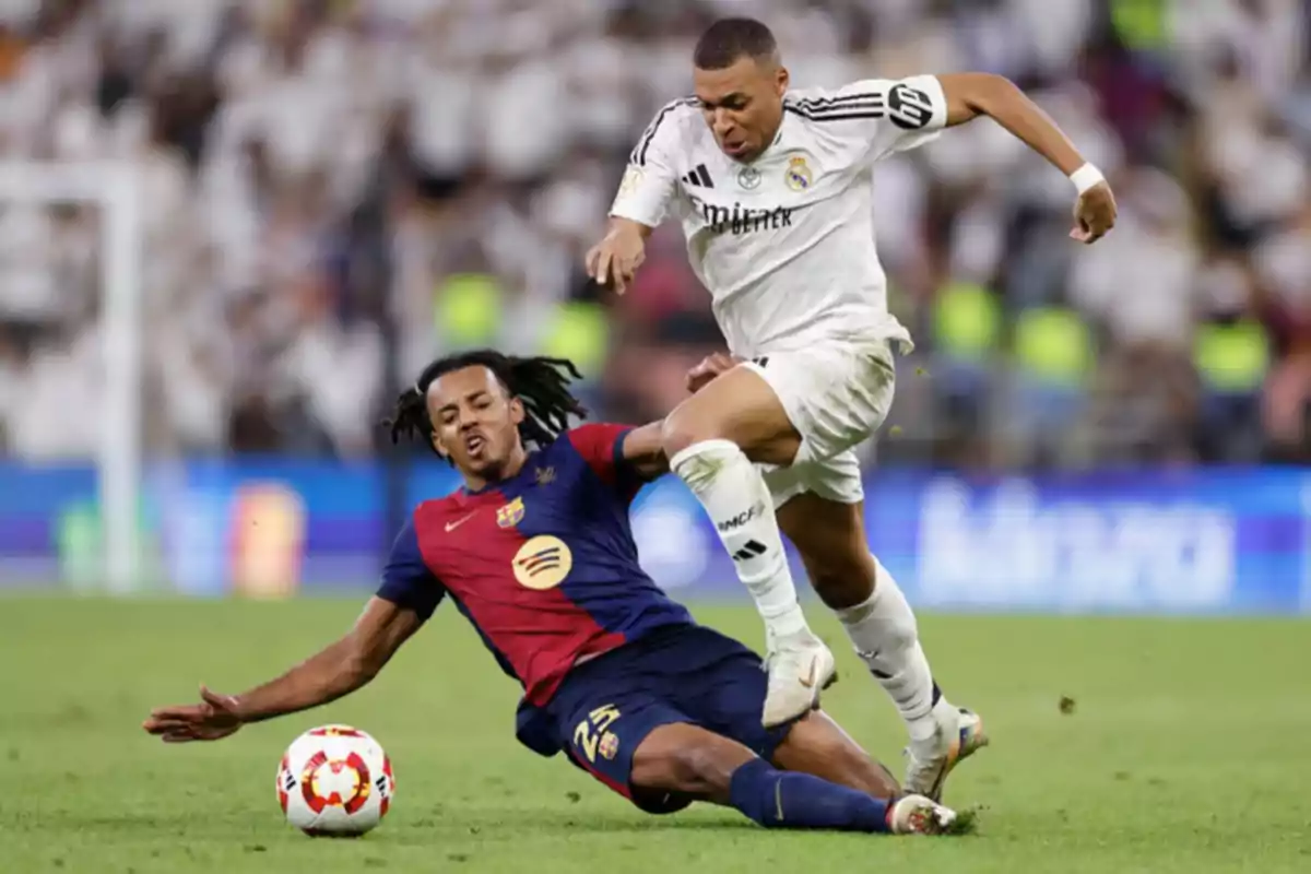 Two soccer players compete for the ball during a match. Two soccer players compete for the ball during a match.