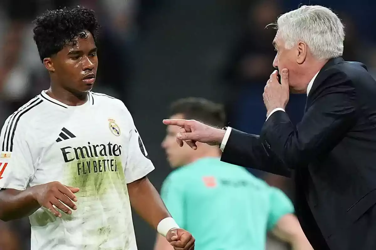 Soccer coach giving instructions to a Real Madrid player during a match Soccer coach giving instructions to a Real Madrid player during a match