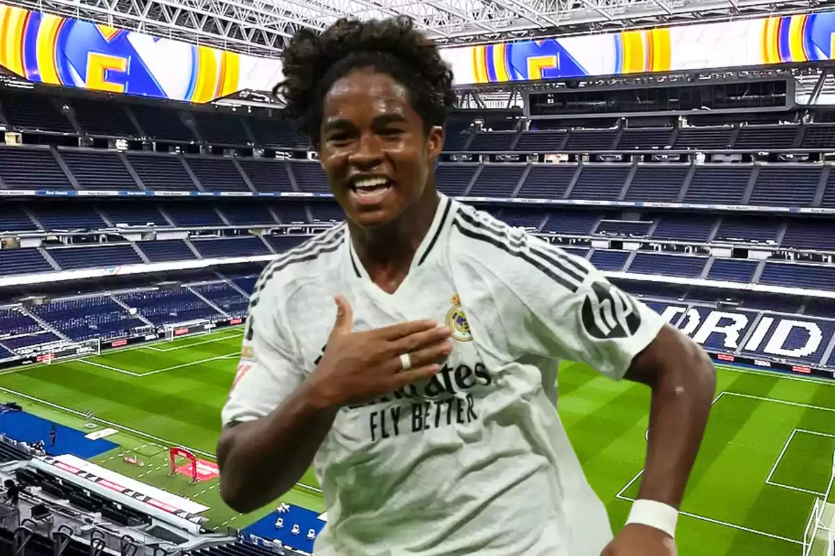 Football player celebrating in an empty stadium wearing a white jersey.