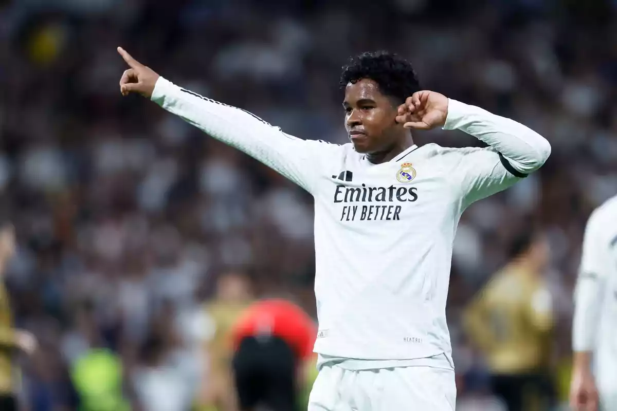 Real Madrid player celebrating a goal on the field. Real Madrid player celebrating a goal on the field.
