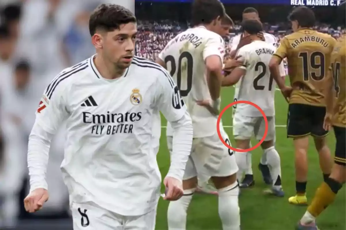 Un jugador de fútbol del Real Madrid con el uniforme blanco está en el campo, mientras que en el fondo se observa a otros jugadores reunidos, uno de ellos con un círculo rojo alrededor de su pierna.