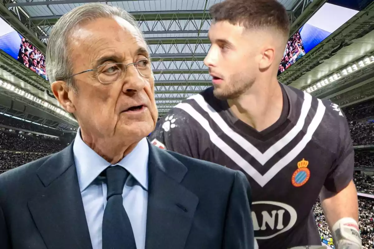 An older man in a suit and glasses next to a player in a black uniform in a stadium full of spectators.