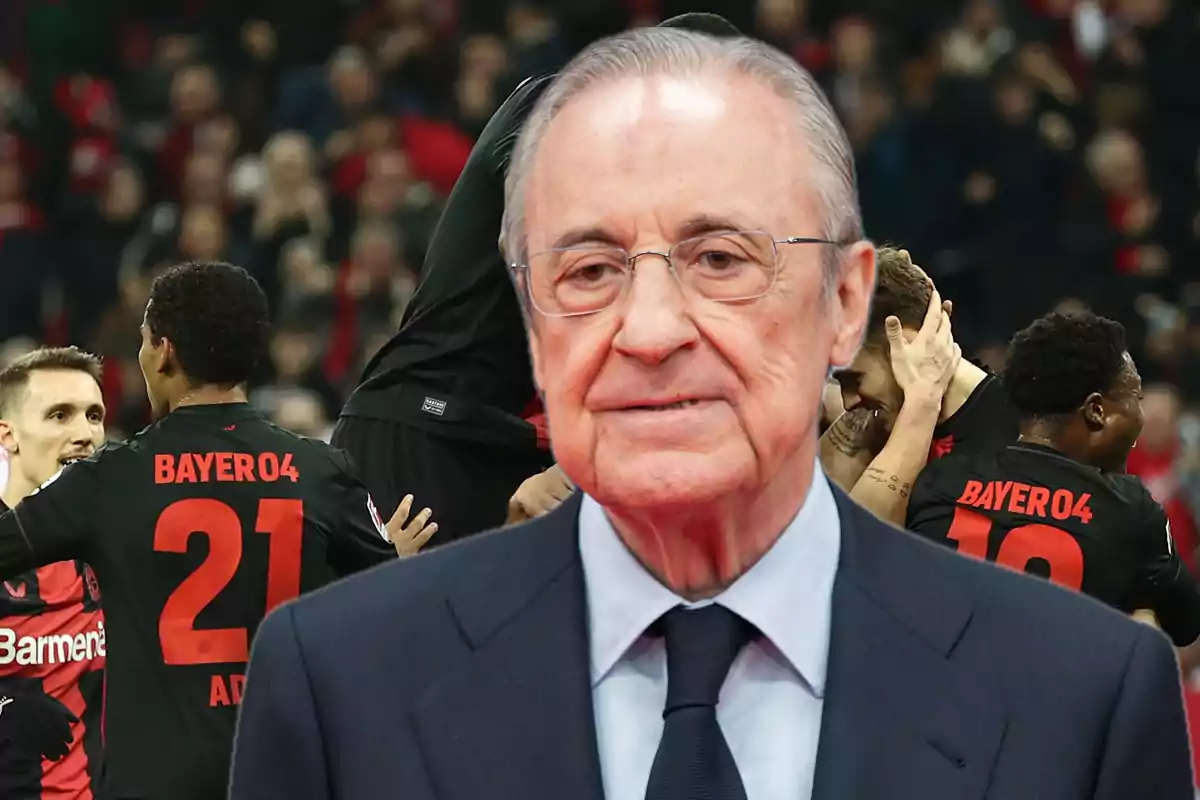 An older man with glasses and a suit appears in the foreground, while in the background a group of Bayer 04 players is seen celebrating on the field.