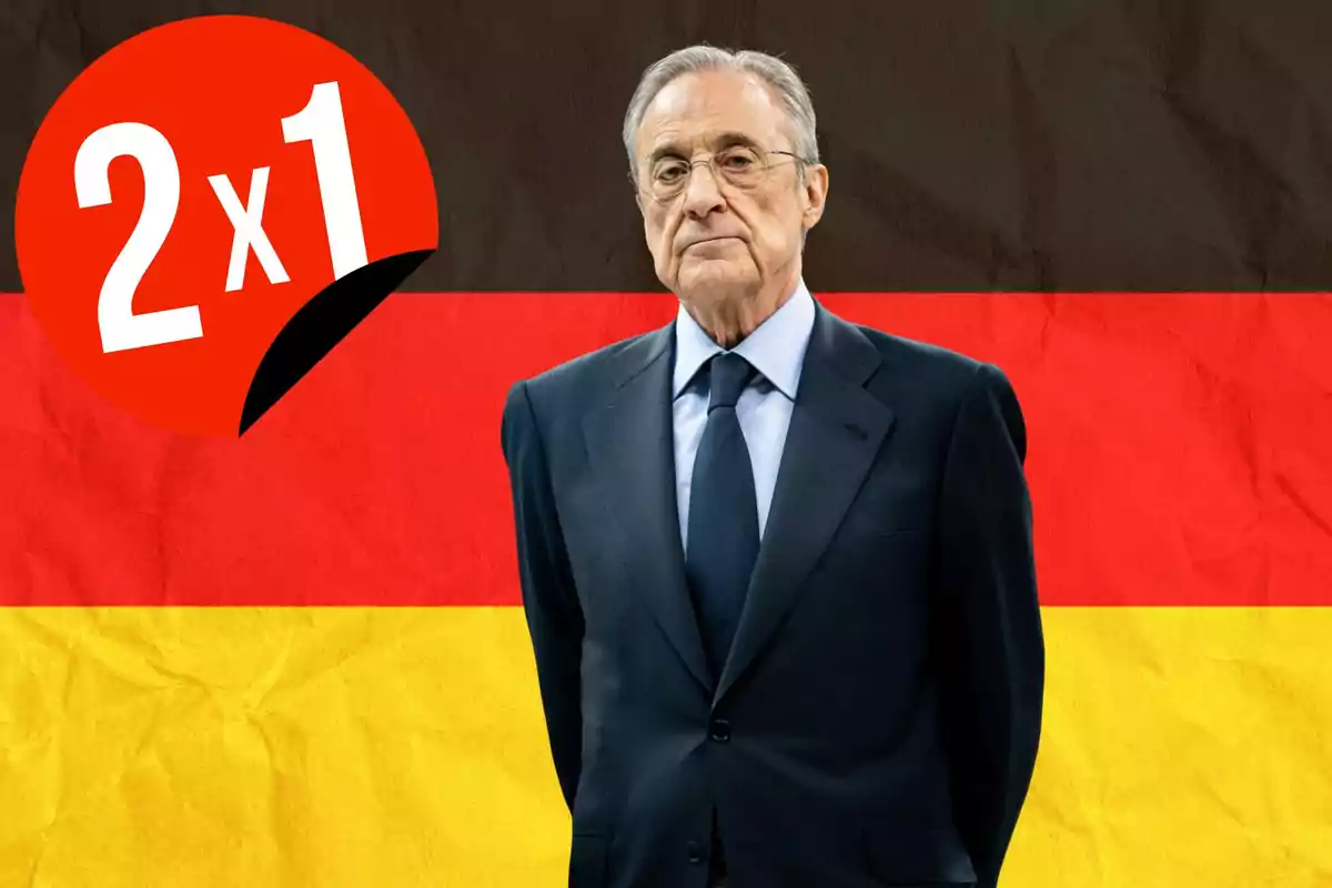 Un hombre mayor con traje oscuro está de pie frente a un fondo con los colores de la bandera de Alemania y un círculo rojo con "2x1" en blanco.