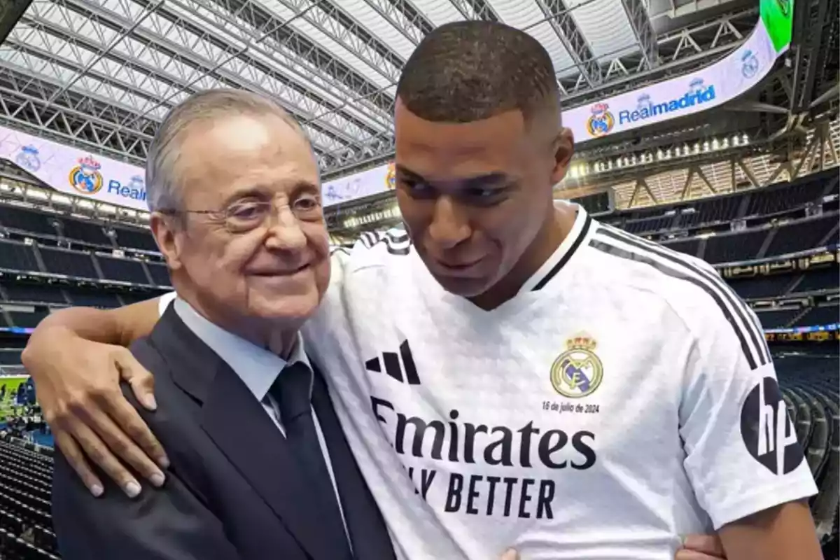 Dos personas abrazándose en un estadio de fútbol con una camiseta del Real Madrid.