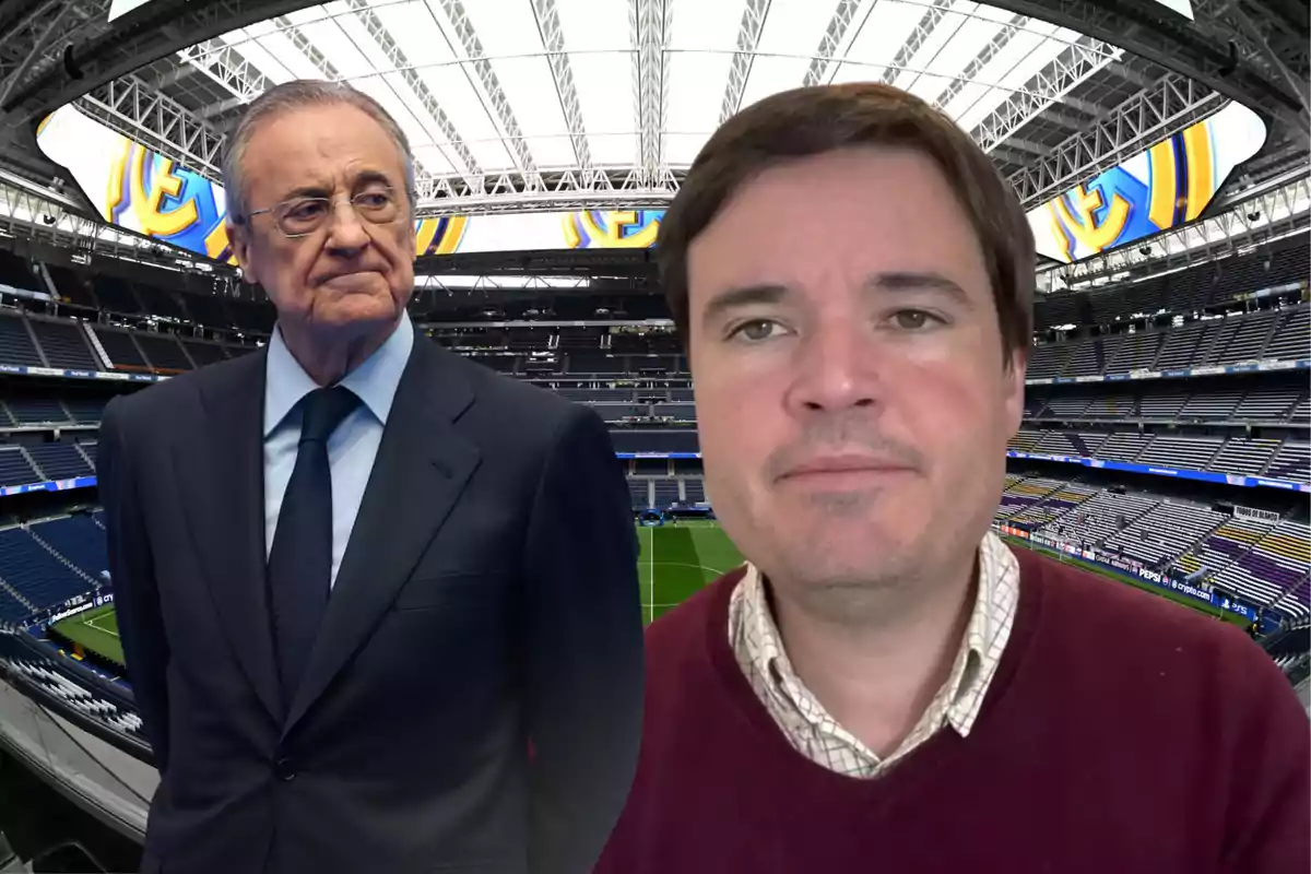 Two men pose inside a modern soccer stadium with stands and a retractable roof.