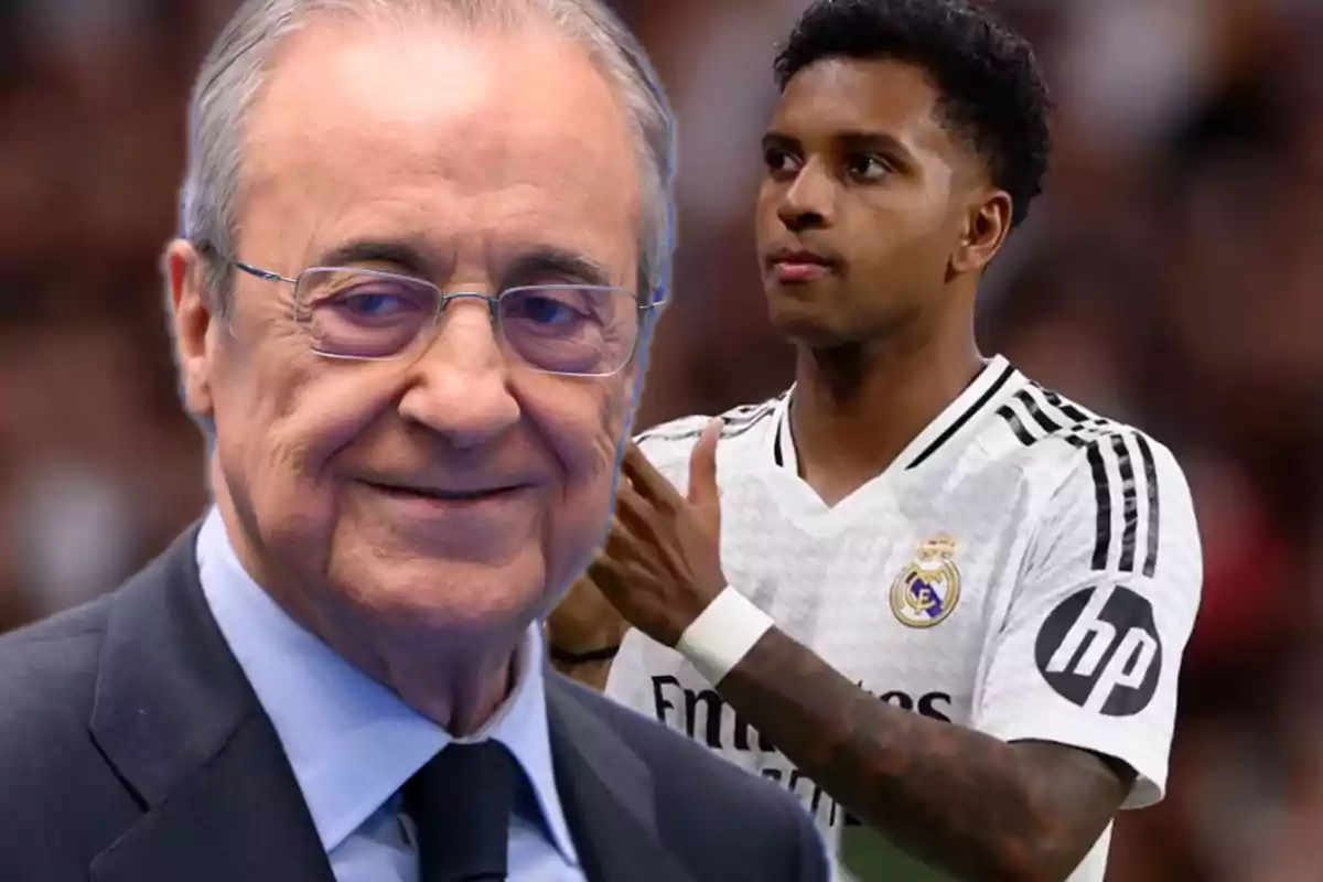 An older man with glasses and a young player in a white uniform in a stadium.