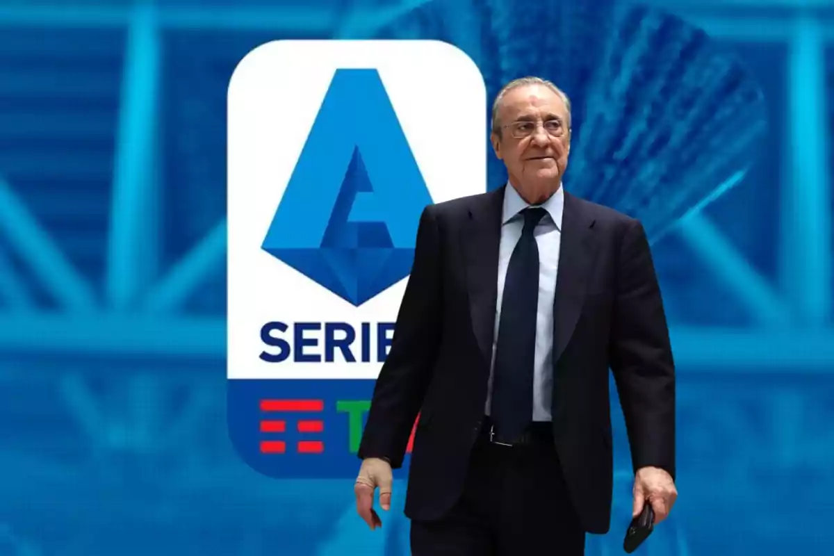 A man in a dark suit and tie walks in front of a Serie A logo.