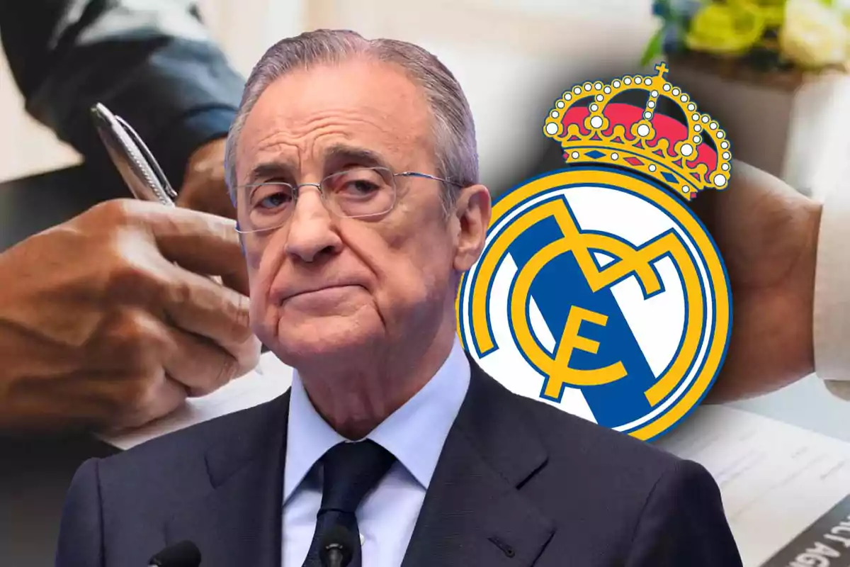 Un hombre con expresión seria frente al logo del Real Madrid mientras alguien firma un documento.