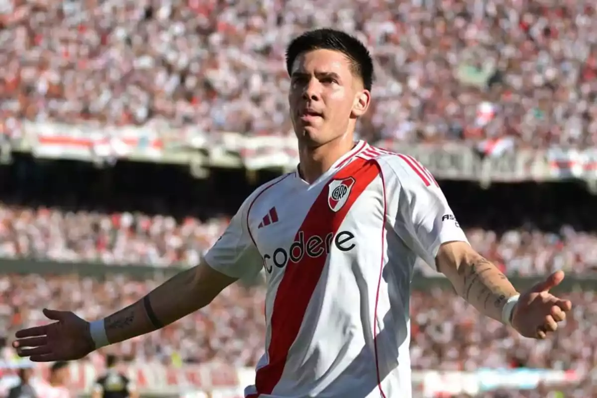 River Plate player celebrating a goal in the stadium with the stands full of fans River Plate player celebrating a goal in the stadium with the stands full of fans