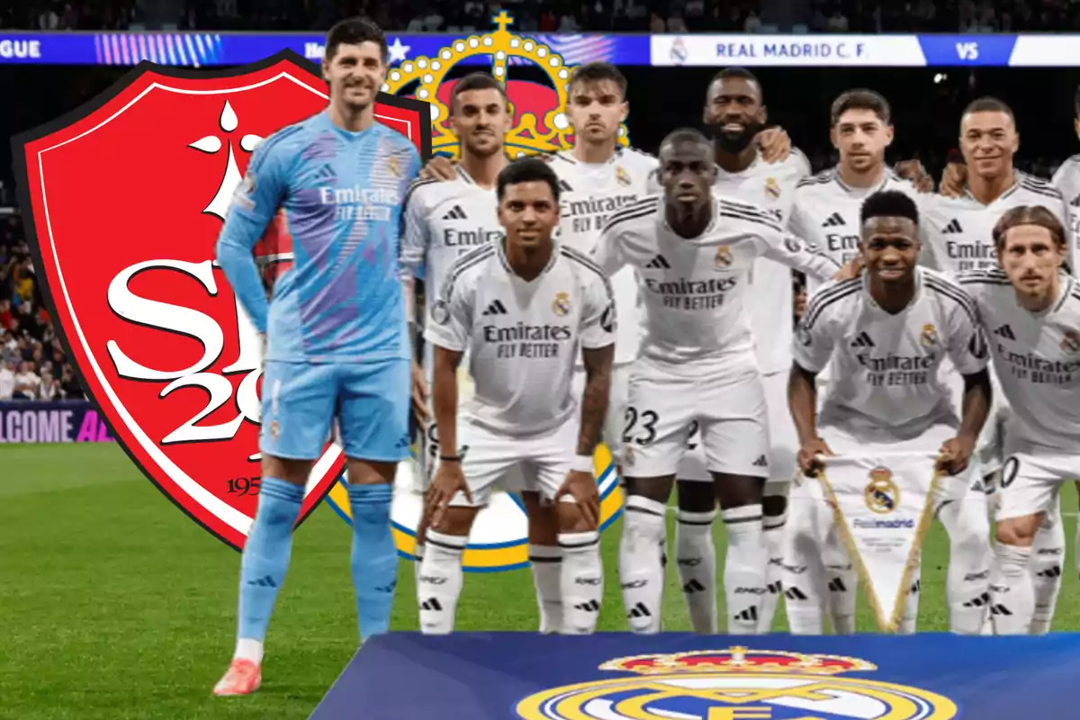 Real Madrid football players posing on the field with a crest in the background.