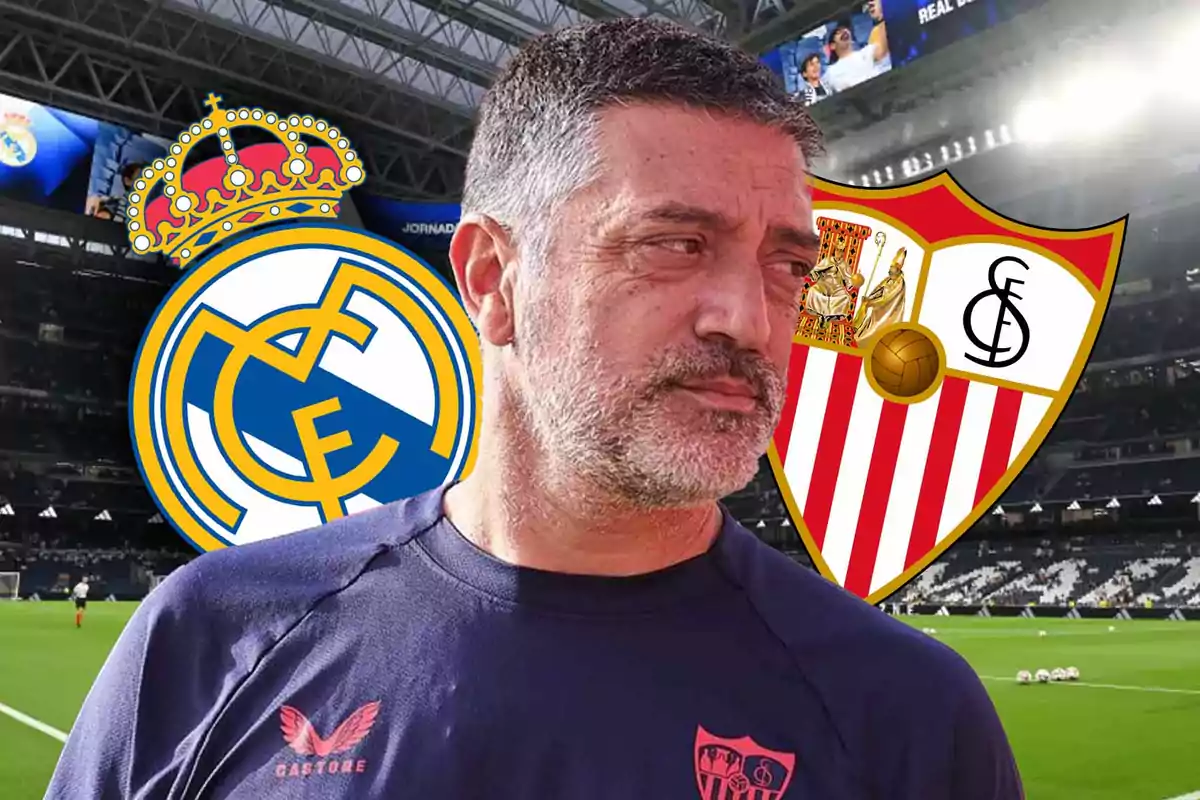 Bearded man in a soccer stadium with the Real Madrid and Sevilla FC crests in the background.