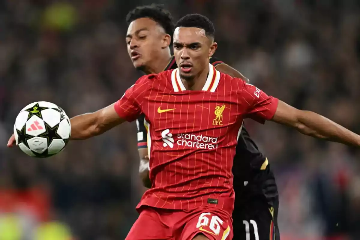 Liverpool soccer player controlling the ball during a match. Liverpool soccer player controlling the ball during a match.