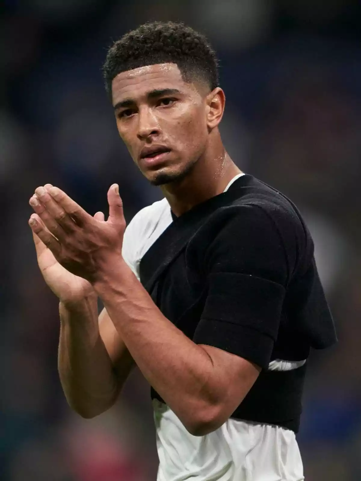 A player clapping on the field. A player clapping on the field.