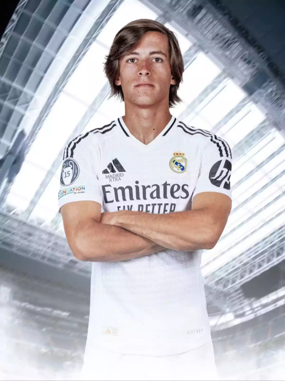A player in a Real Madrid uniform posing with crossed arms in a stadium. A player in a Real Madrid uniform posing with crossed arms in a stadium.