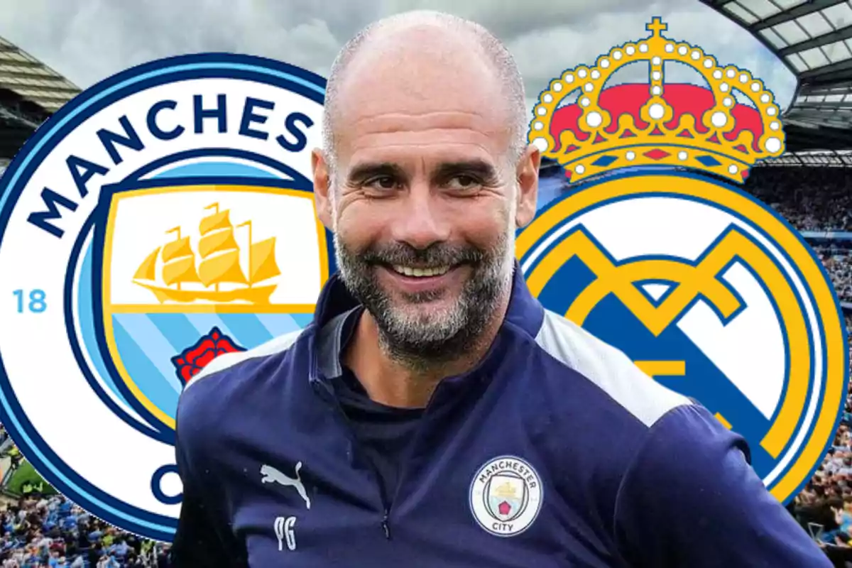 Smiling coach in Manchester City uniform in front of the Manchester City and Real Madrid crests in a stadium full of fans