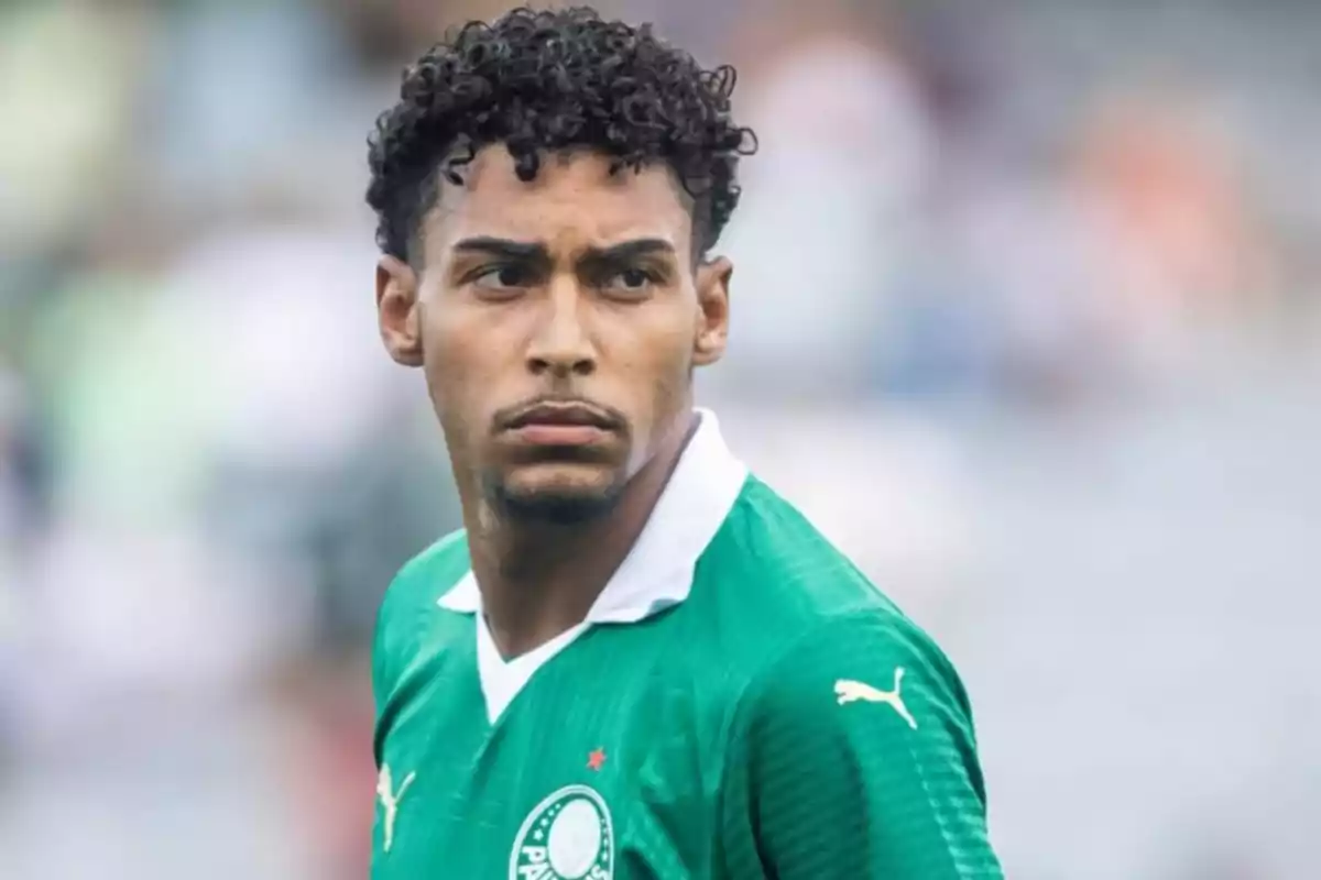 A player in a green jersey looks to the side on a playing field. A player in a green jersey looks to the side on a playing field.