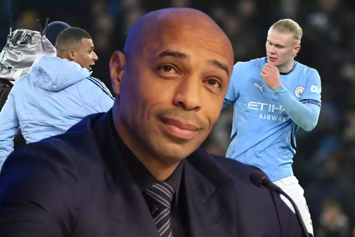 A man in the foreground wearing a dark suit and tie, in the background two people in light blue sportswear.