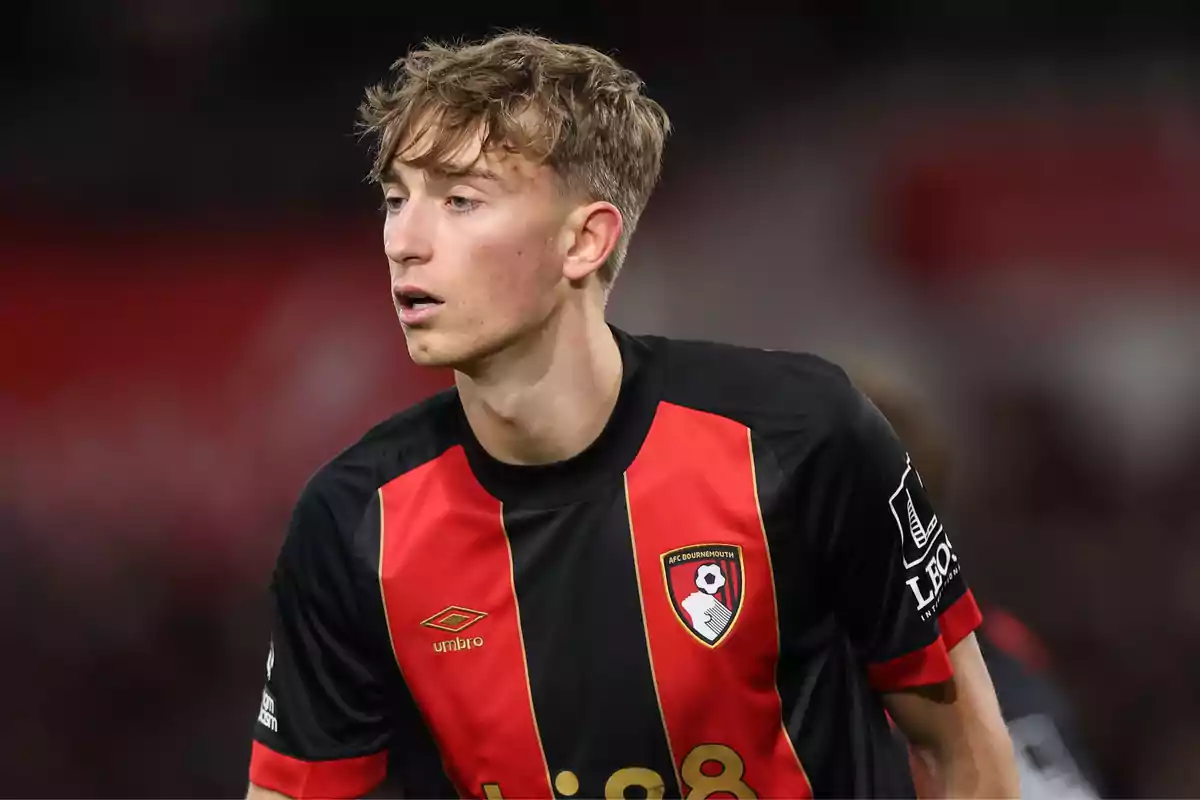 A player in the AFC Bournemouth uniform during a match. A player in the AFC Bournemouth uniform during a match.