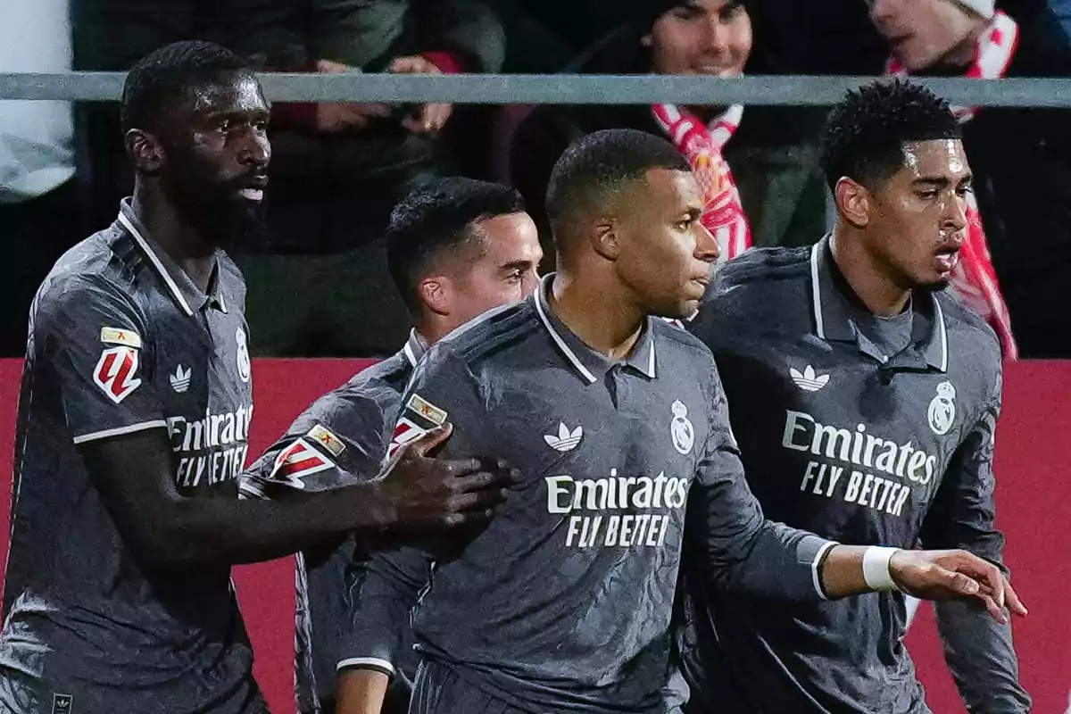 Real Madrid soccer players celebrating during a match.