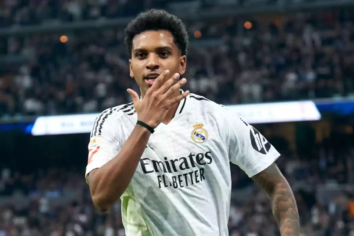 Football player celebrating a goal in a stadium full of spectators. Football player celebrating a goal in a stadium full of spectators.
