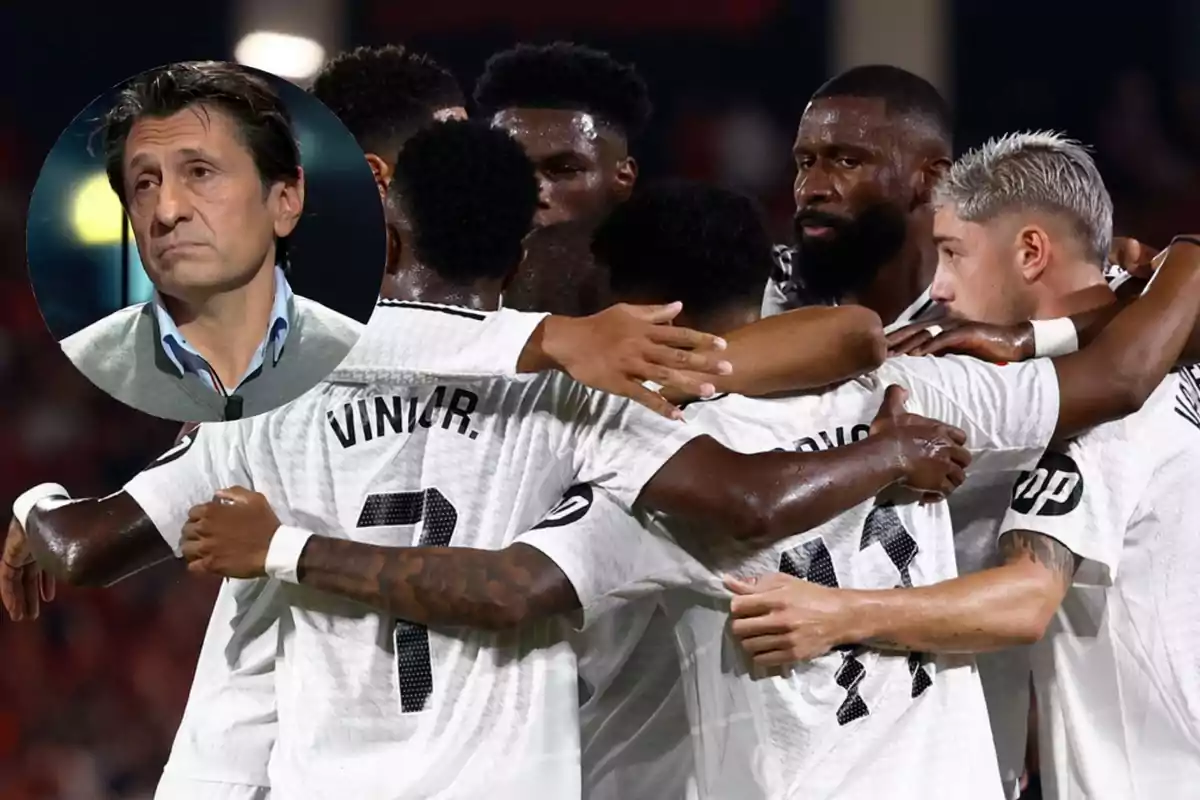 A group of soccer players hug on the field while a man appears in a box in the upper left corner.