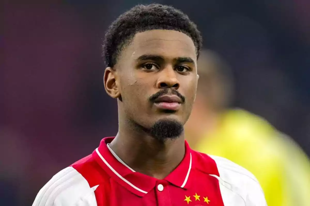 A player in a red and white uniform looking forward. A player in a red and white uniform looking forward.