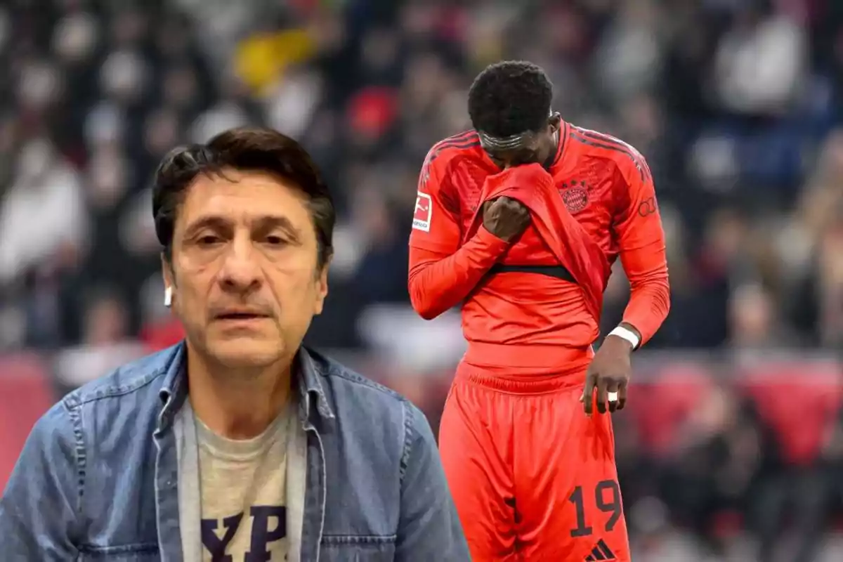 A man wearing headphones and a denim jersey stands in the foreground while a soccer player in a red uniform covers his face with his jersey in the background.