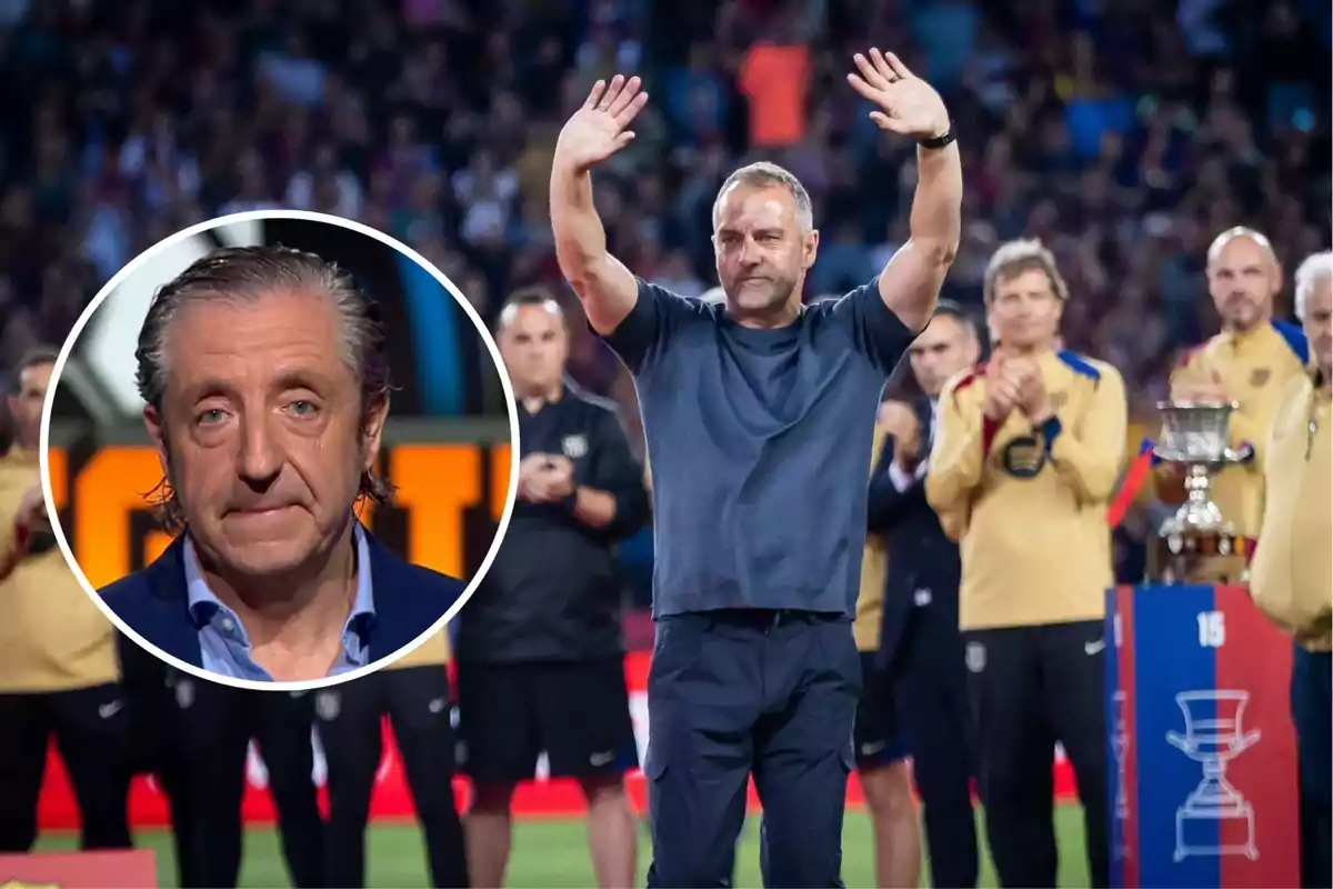 A man in a blue jersey raises his hands in a stadium while other people applaud, and there is a box with the face of another man.