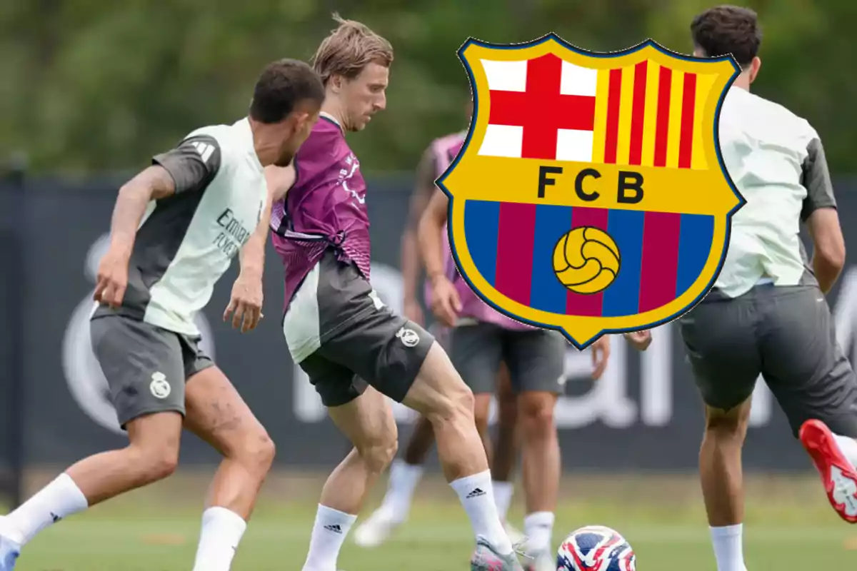 Real Madrid players training on the field with the FC Barcelona crest superimposed in the center of the image