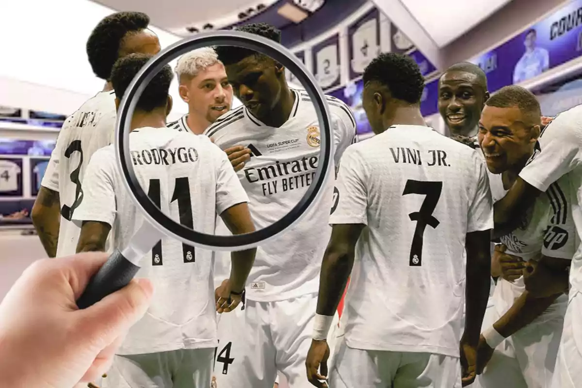 A group of players wearing white Real Madrid jerseys in a locker room, with a magnifying glass focusing on one of them.
