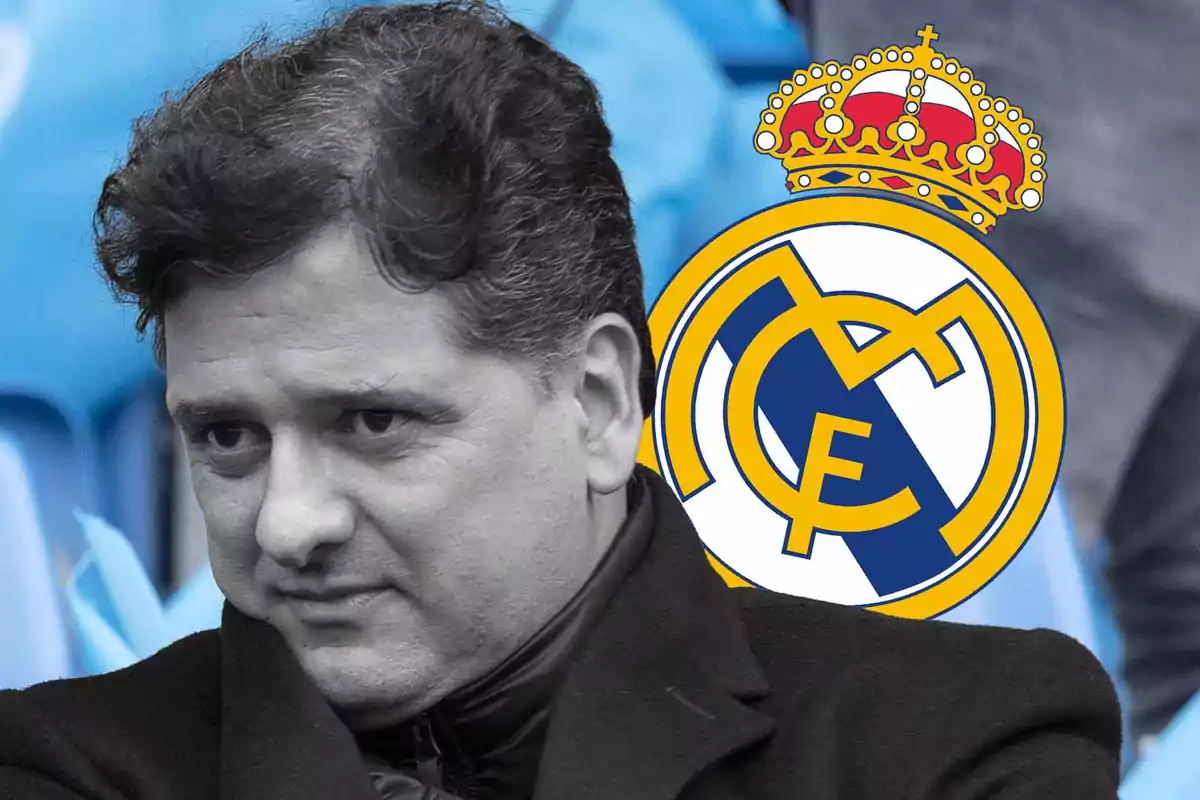 Dark-haired man with a serious expression and the Real Madrid crest in the background