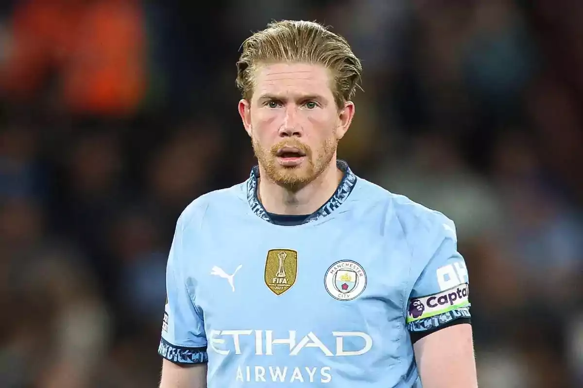 A player in a light blue jersey on the field. A player in a light blue jersey on the field.