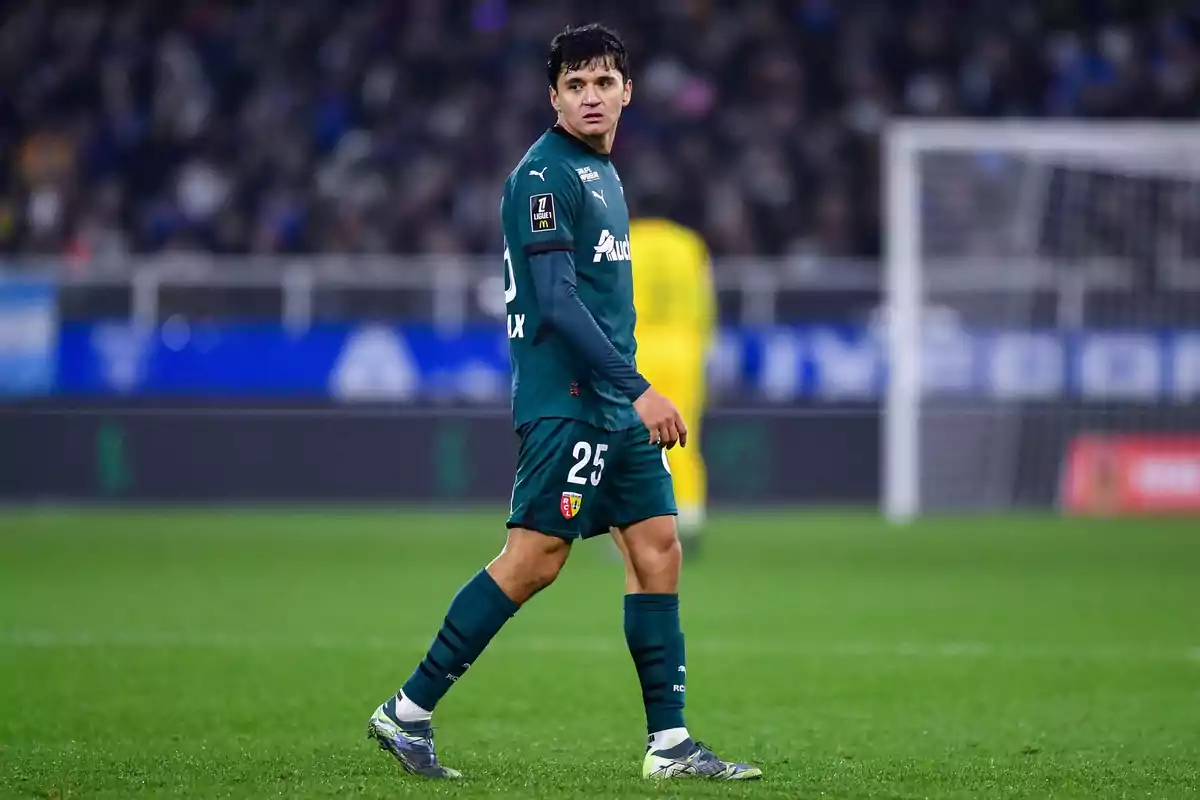 Soccer player on the field wearing a green uniform with the number 25. Soccer player on the field wearing a green uniform with the number 25.