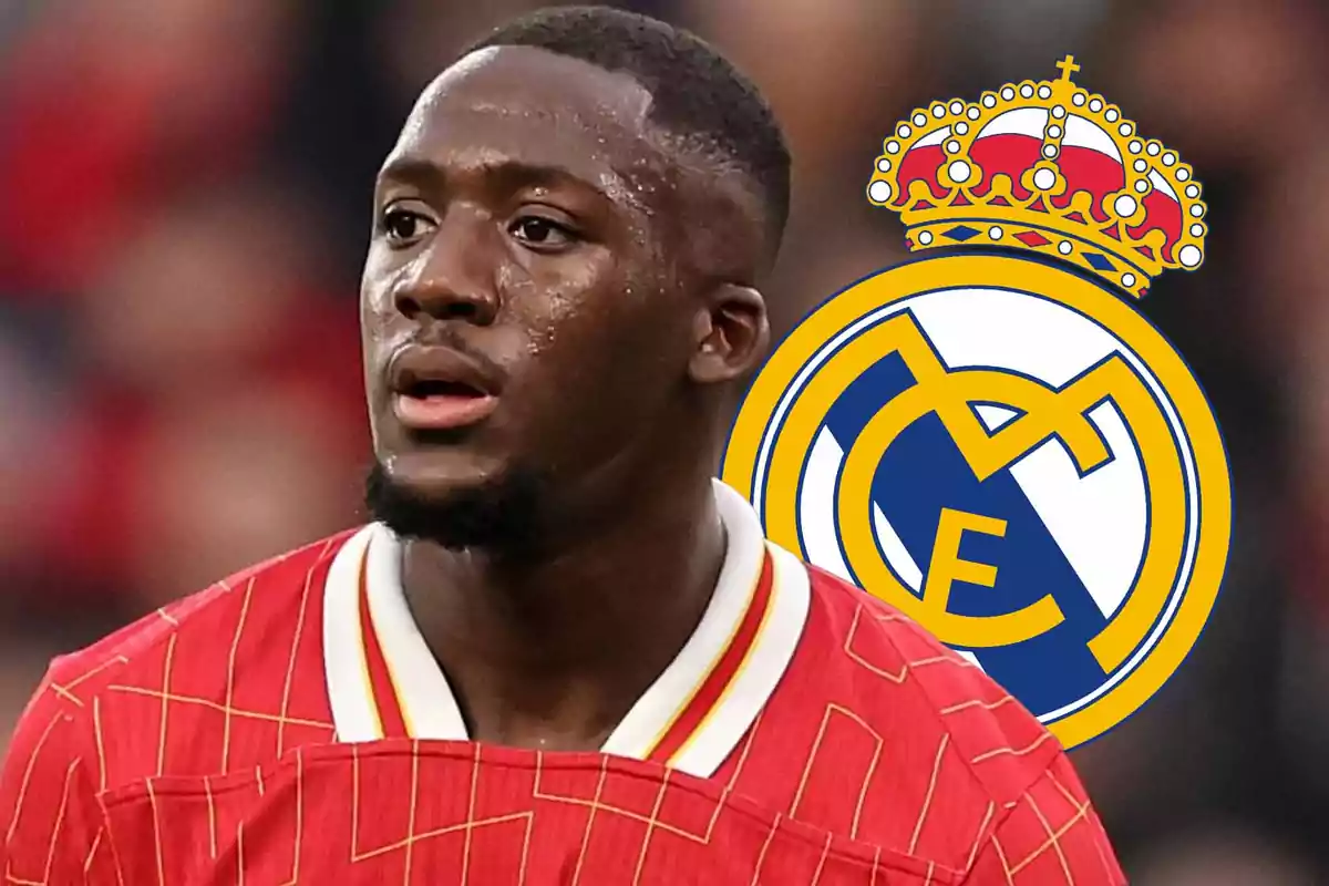 Soccer player with a red jersey and the Real Madrid crest in the background.