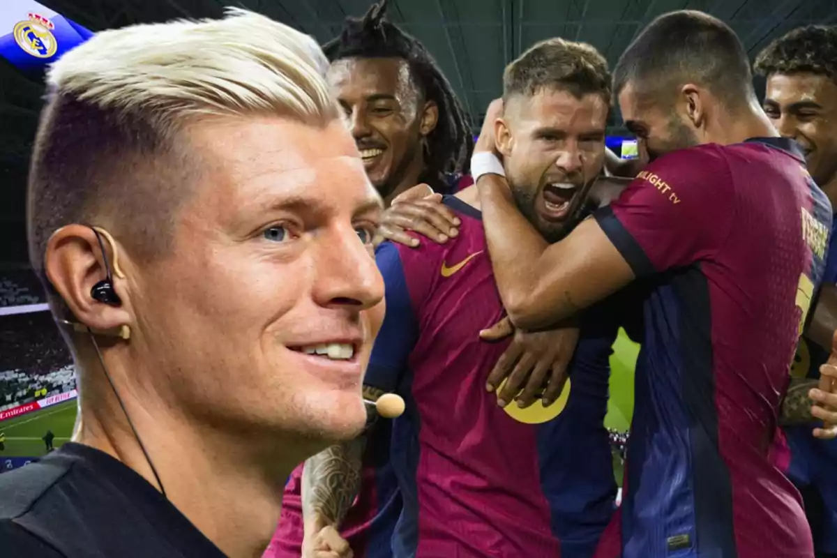 A group of players celebrates effusively while a blond man with headphones smiles in the foreground.
