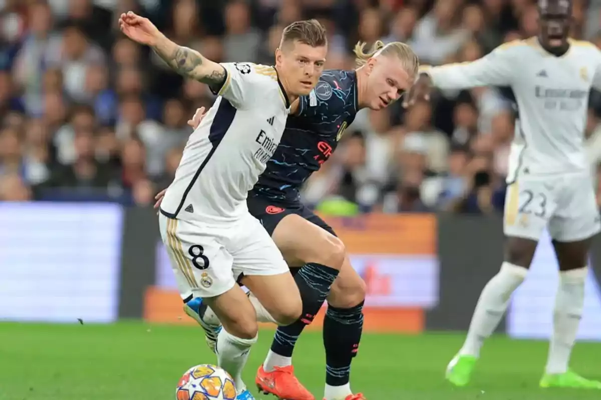 Two soccer players compete for the ball during a match.