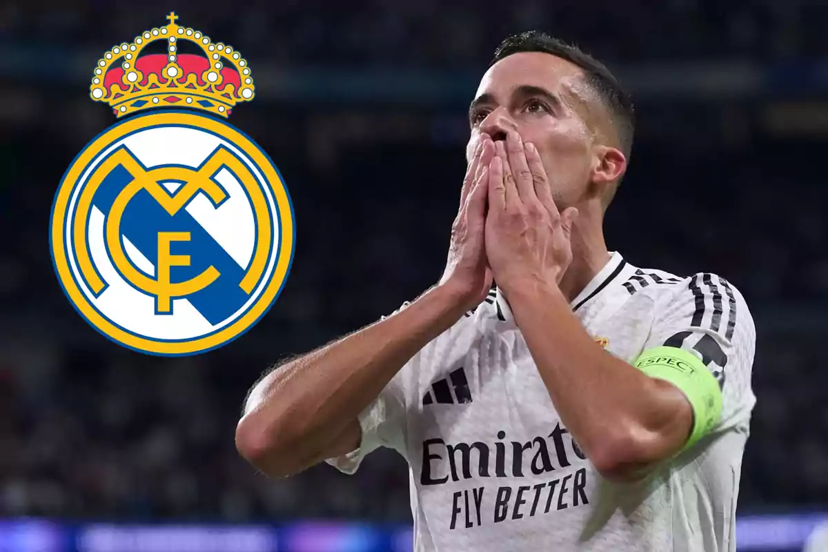 A player in a white uniform with a green armband holds his hands to his face next to the Real Madrid crest.