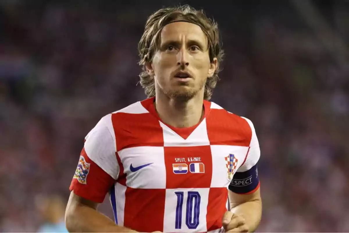 Soccer player wearing Croatia’s uniform in a match, with the number 10 and a captain’s armband Soccer player wearing Croatia’s uniform in a match, with the number 10 and a captain’s armband