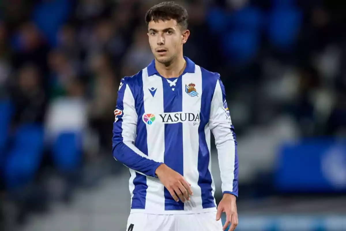 Soccer player in blue and white uniform on the playing field. Soccer player in blue and white uniform on the playing field.
