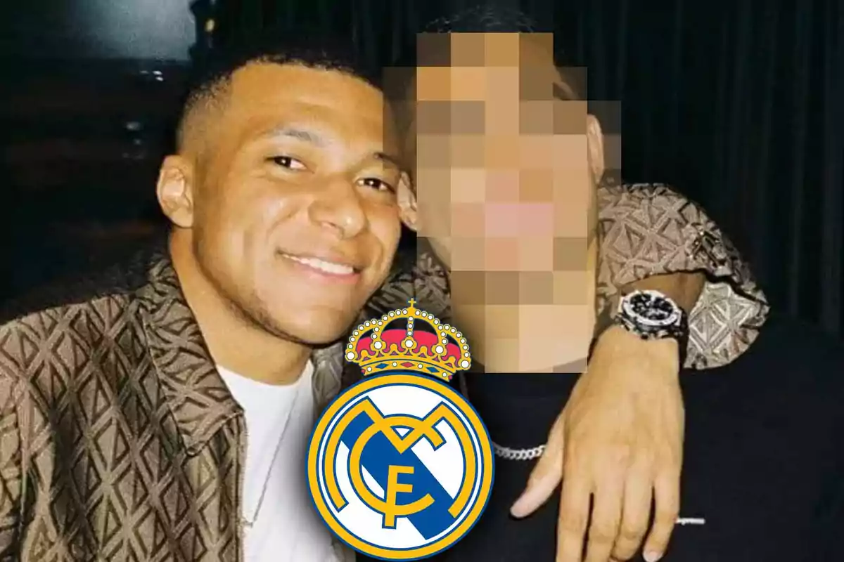 Two people posing together, one of them with a pixelated face, with a Real Madrid crest in the foreground.