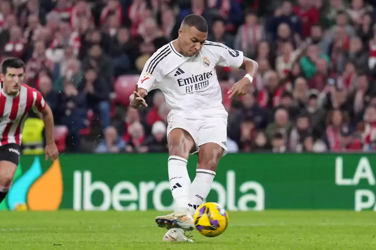 Soccer player in action during a match with white uniform and ball in motion. Soccer player in action during a match with white uniform and ball in motion.