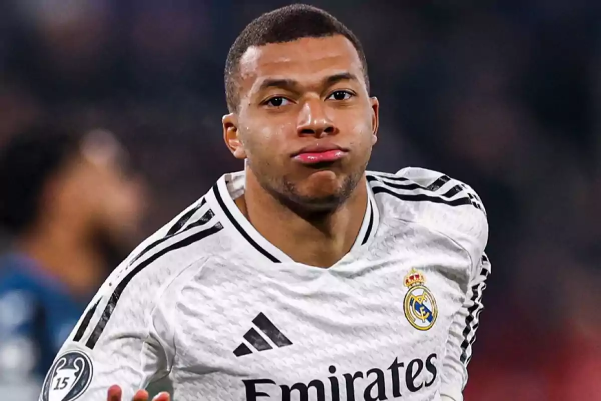 A soccer player in a white uniform during a match.