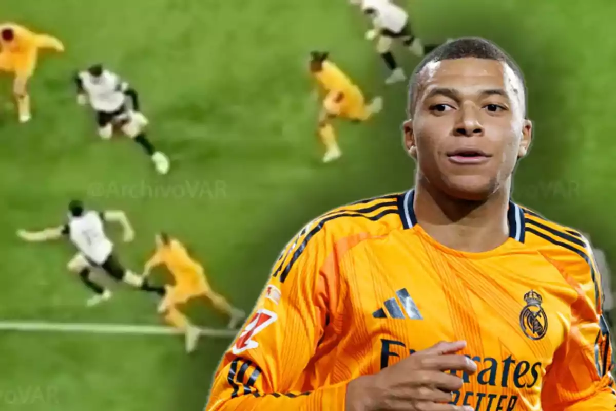 A soccer player in an orange uniform in the foreground and a soccer match scene in the background.