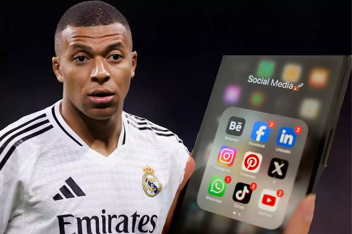 A soccer player wearing a white Real Madrid jersey is seen standing next to a mobile phone displaying social media apps.