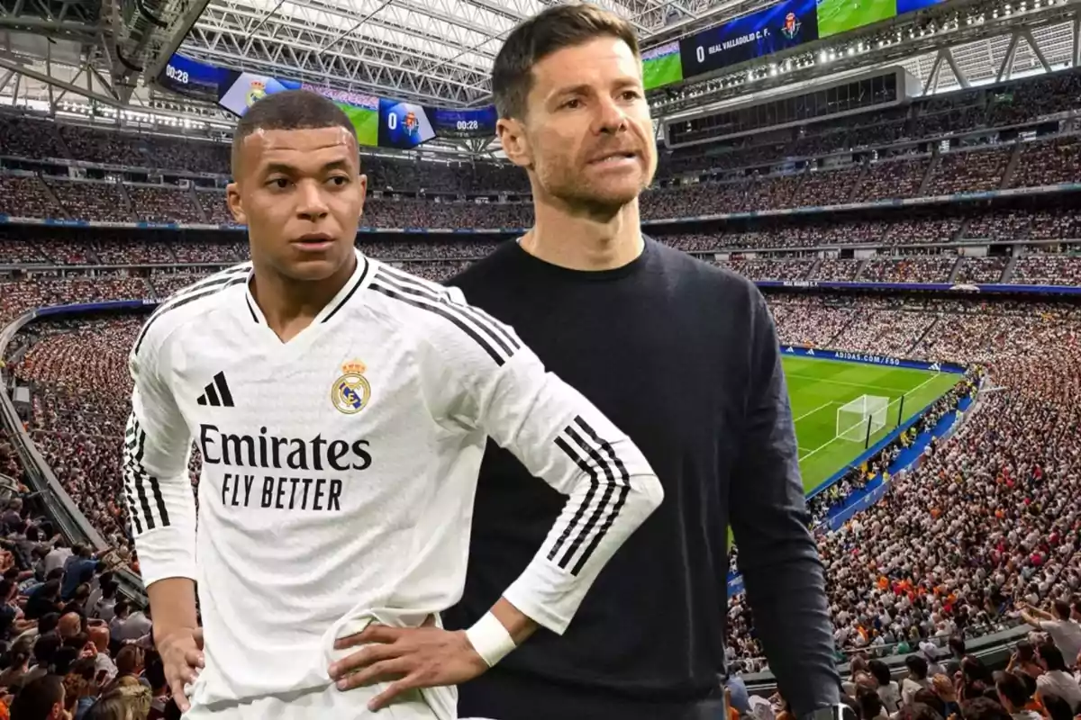 Dos personas en el estadio Santiago Bernabéu una con el uniforme del Real Madrid y otra con ropa casual con las gradas llenas de aficionados y el campo de fútbol al fondo