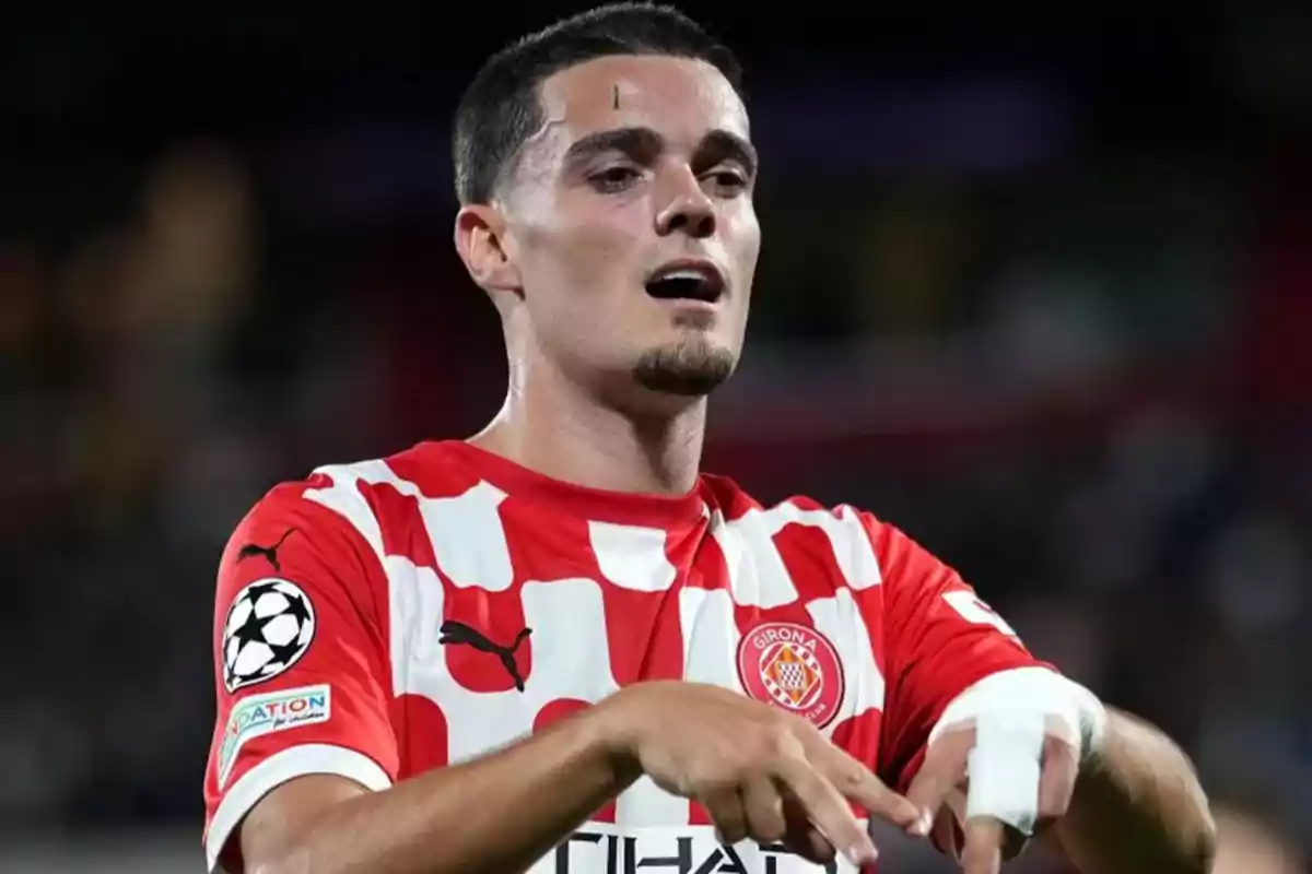 Football player wearing a Girona FC jersey during a match.